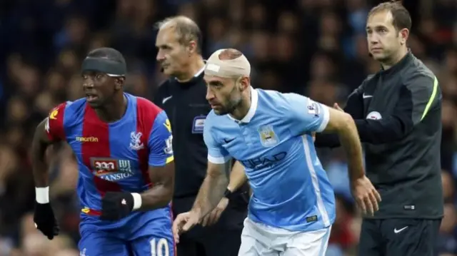 Pablo Zabaleta and Yannick Bolasi have bandages on their heads