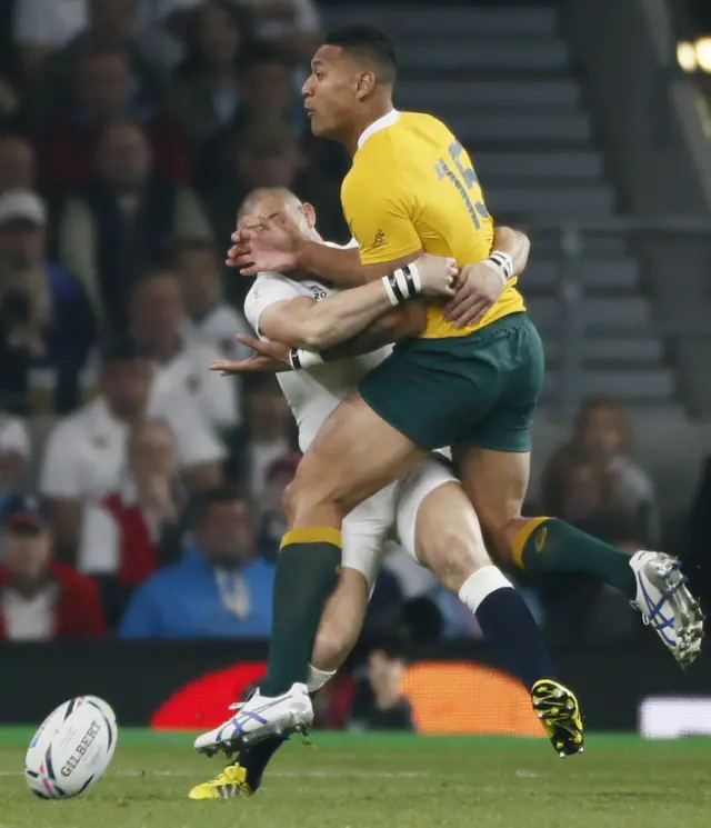 Mike Brown tackles Israel Folau