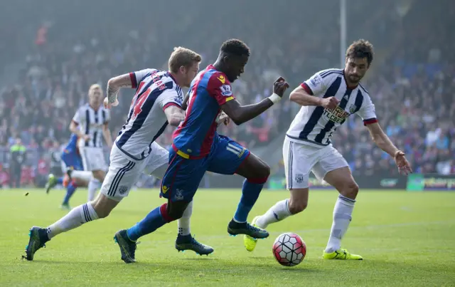 Wilfried Zaha runs with possession