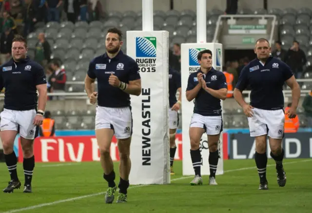 Scottish players do a lap of the pitch