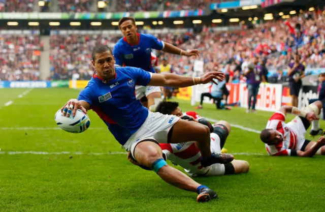 Samoa's Paul Perez scores a try