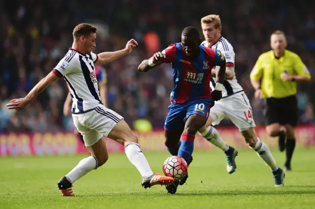 Yannick Bolasie attempts to go past James Chester