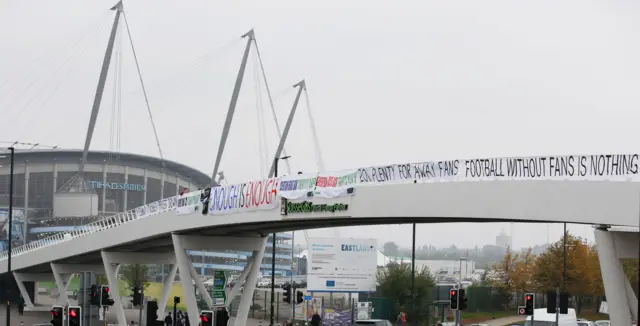 Protest banners outside the Eithad stadium