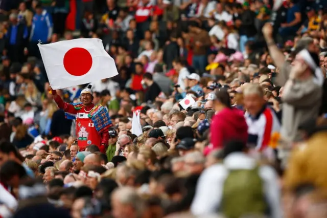 A Japan fan flies the flag