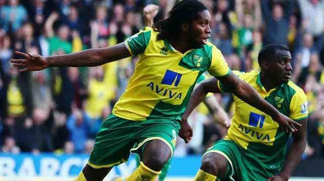 Dieumerci Mbokani celebrates