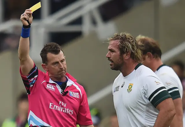 Jannie Du Plessis is shown a yellow card by referee Nigel Owens