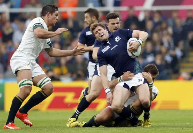 Scotland's Richie Vernon is tackled