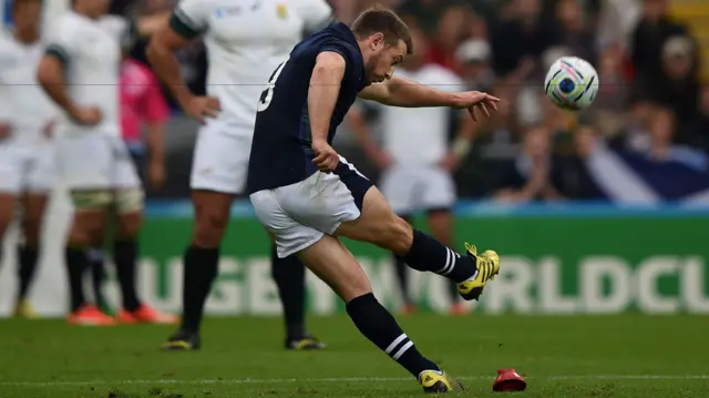 Greg Laidlaw kicks a penalty