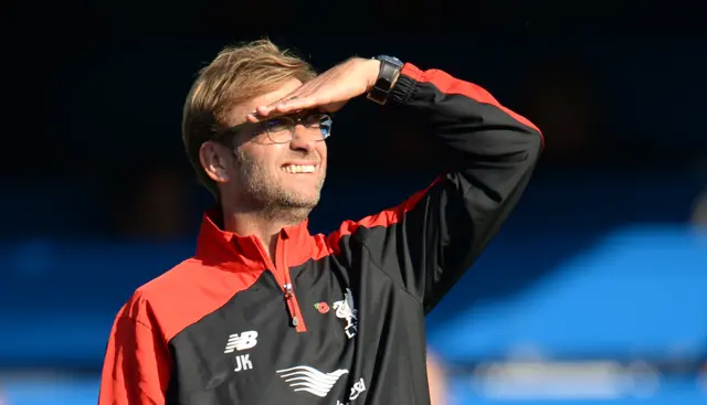 Jurgen Klopp squints in the sun