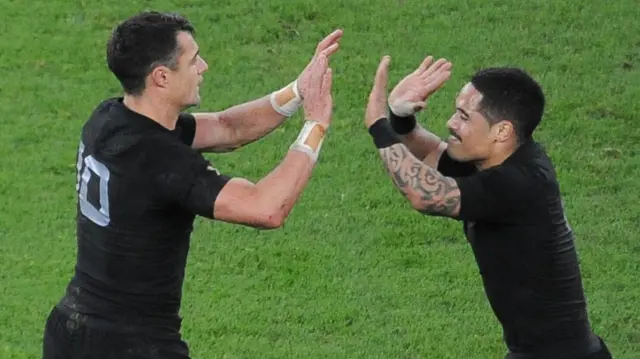 Dan Carter and Aaron Smith celebrate