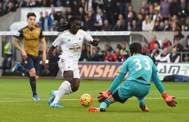 Bafetimbi Gomis in action with Arsenal's Petr Cech