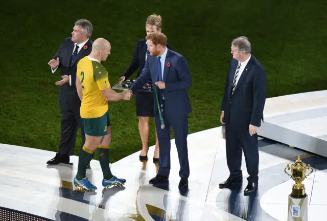 Stephen Moore collects a medal