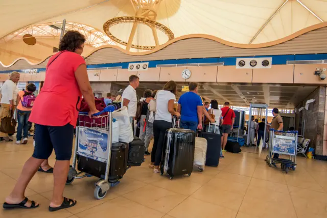 Passengers line up to depart from Sharm el-Sheikh Airport hours after a Russian aircraft carrying 224 people, including 17 children, crashed about 20 minutes after taking off from Sharm el-Sheikh, a Red Sea resort popular with Russian tourists, in south Sinai, Egypt, on 31 October 2015