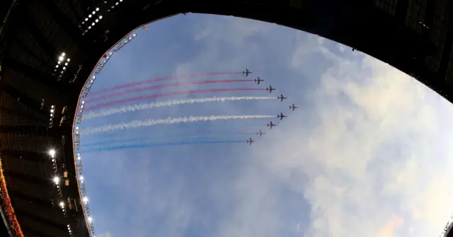 The Red Arrows fly over the stadium