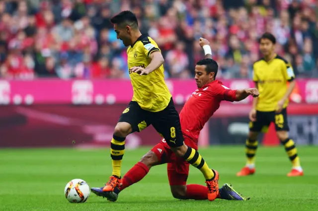 Ilkay Gundogan attempts to play the ball