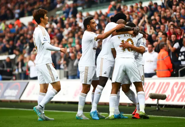 Swansea celebrate their opening goal