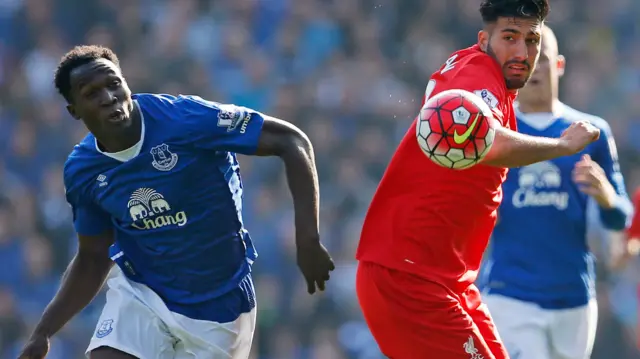 Liverpool's Emre Can in action with Everton's Romelu Lukaku