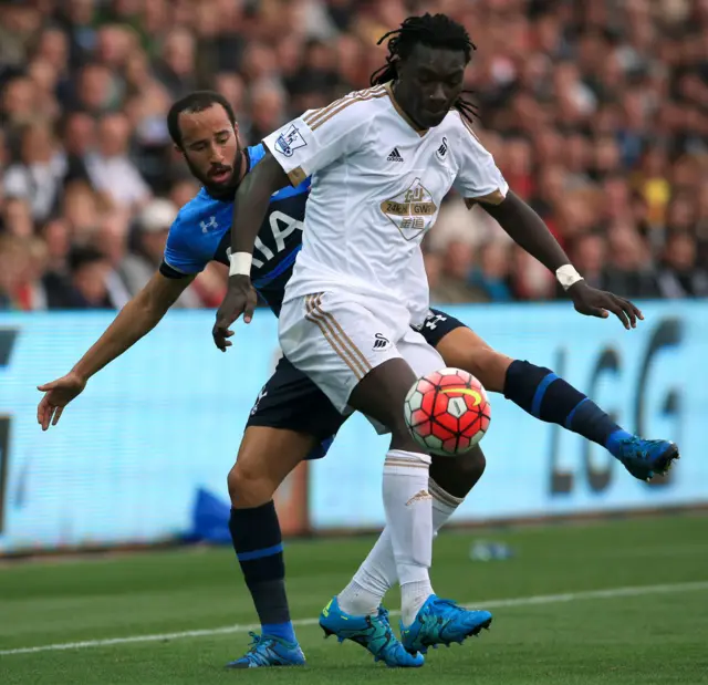 Gomis and Townsend battle for the ball