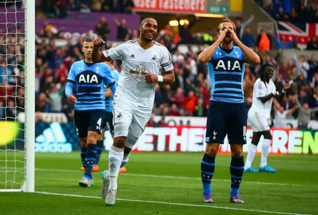 Ashley Williams celebrates Harry Kane's own goal