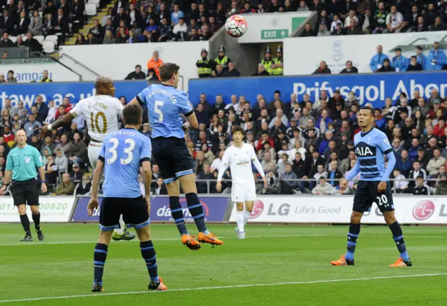 Ayew rises for the header