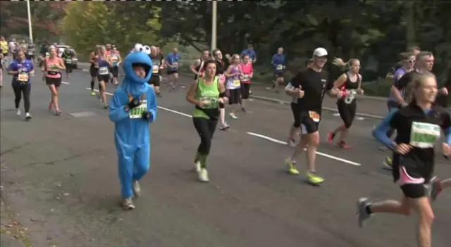 A runner dressed as the cookie monster