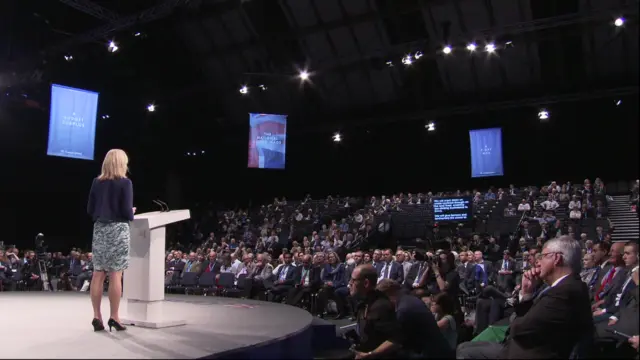 Liz Truss addressing the Conservative conference