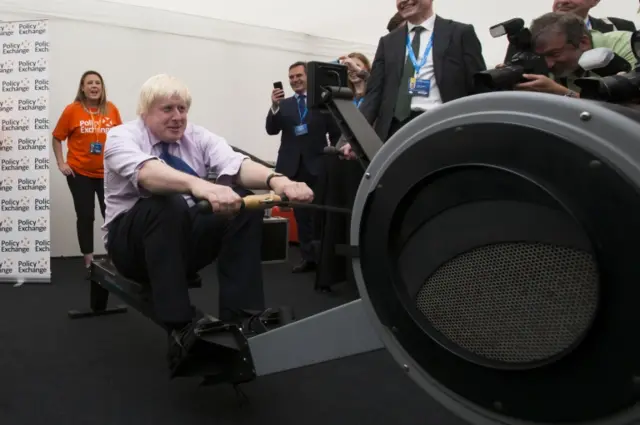 James Cracknell (left) and Boris Johnson on rowing machines at the Conservative conference