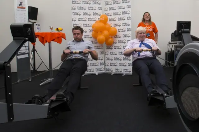 James Cracknell (left) and Boris Johnson on rowing machines at the Conservative conference