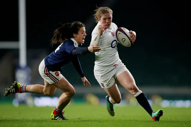 England's Lydia Thompson goes past France's Celine Heguy