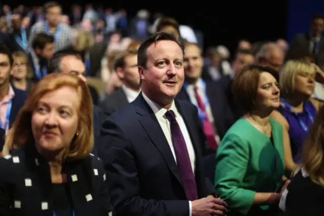 David Cameron listening to a speech at the Conservative conference