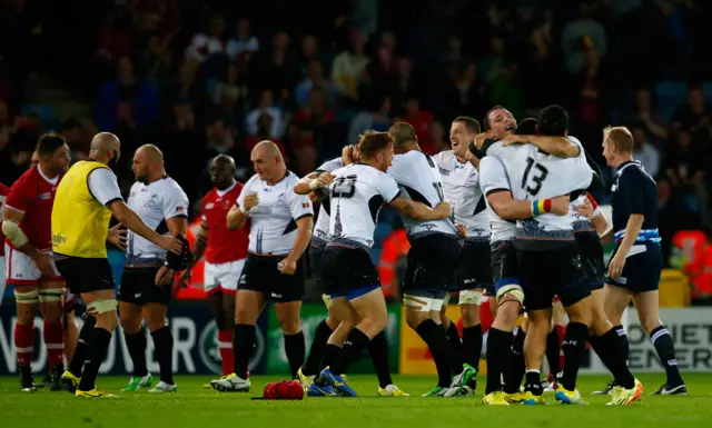 Romania players celebrate victory