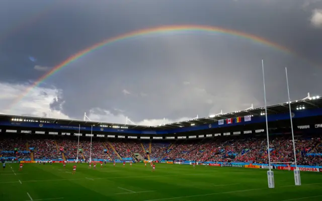 A rainbow shines over the stadium