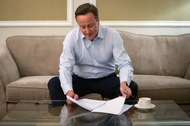 David Cameron working on his conference speech in his hotel room