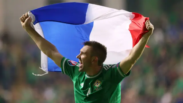 Gareth McAuley celebrates