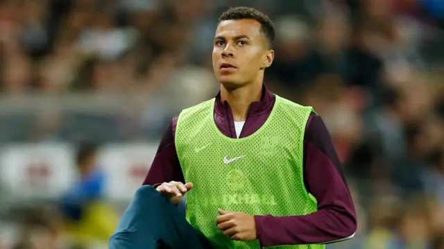 Dele Alli warms up