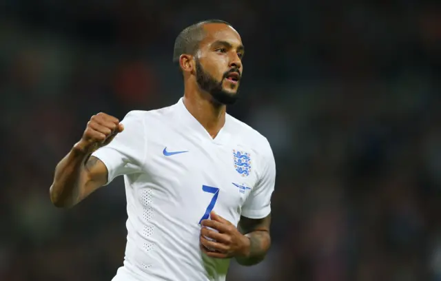 Theo Walcott celebrates giving England the lead