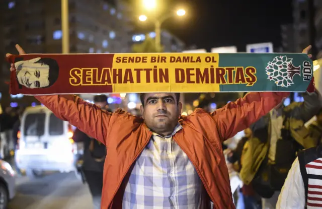 A supporter of Turkey's pro-Kurdish People"s Democratic Party (HDP) celebrates in the southeastern city of Diyarbakir after polls closed on 1 November 2015.