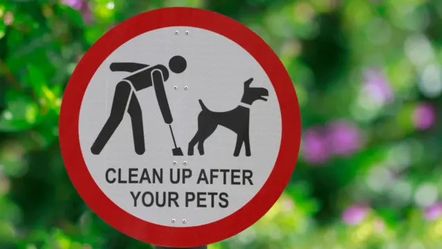 Clean up after your pets signpost