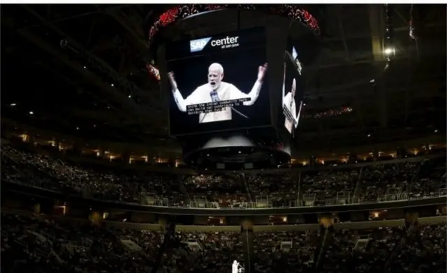 Indian Prime Minister Narendra Modi (C) addresses the crowd during a community reception at SAP Center in San Jose, California September 27, 2015