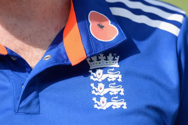 England players wear a poppy on their shirt in respect of Remembrance Day