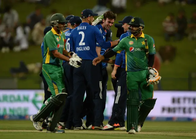 England celebrate taking the wicket of Younus Khan