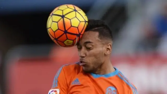 Man heading a football
