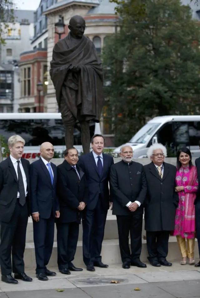 David Cameron (centre) and Indian Prime Minister Narendra Modi (third right) visit the statue of Mahatma Gandhi in Parliament Square,