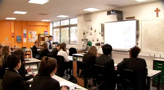 Classroom scene with pupils and teacher