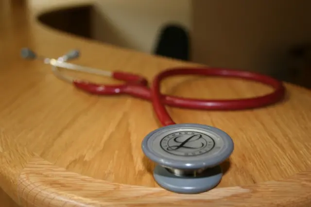 Doctor's stethoscope on desk