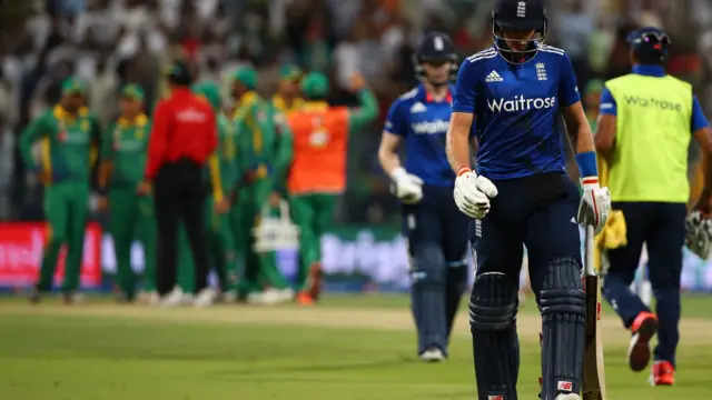 Joe Root walks off the pitch as he's dismissed