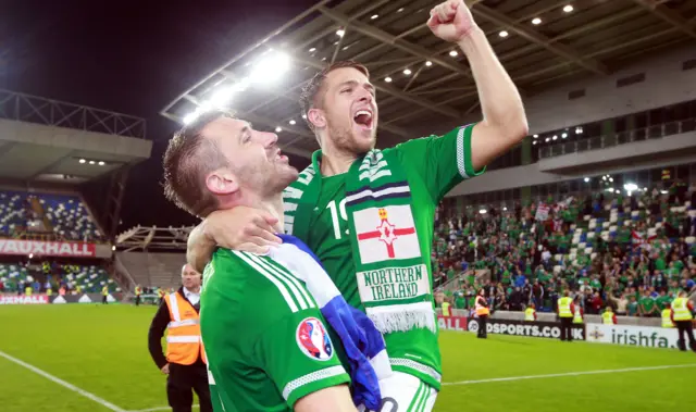 Gareth McAuley and Jamie Ward celebrate Northern Ireland's qualification for Euro 2016