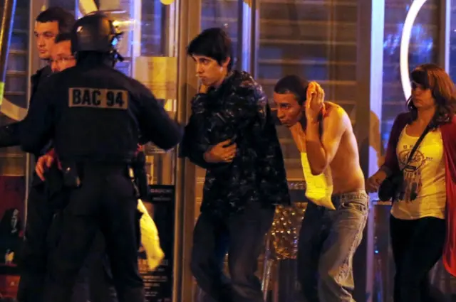 An injured man is evacuated from the Bataclan concert hall