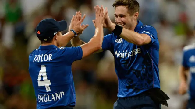 Chris Woakes of England celebrates with James Taylor