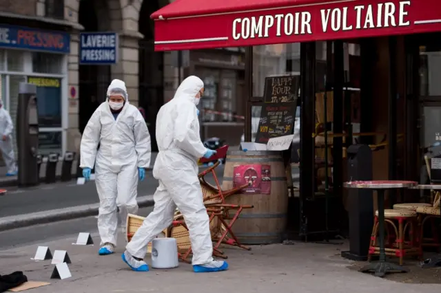 Police forensic experts work on the scene of one the shootings that took place in Paris at the Cafe Comptoir Voltaire in Paris, France, 14 November 2015.